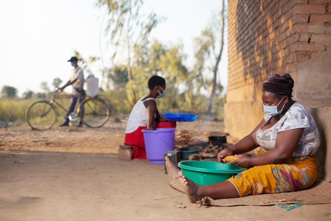 Community health workers meeting outside a rural clinic
